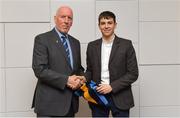 26 November 2018; Brian Mullins, Director of Sport, UCD, presents Ruairi McCormack of Warrenpoint and Down with a UCD scarf during the UCD GAA Sports Scholarship Presentation 2018/2019 at UCD in Dublin. Photo by Piaras Ó Mídheach/Sportsfile