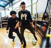 28 November 2018; Former Republic of Ireland defender Stephen Kelly takes on Ryan Scully of St. Paul’s CBS Primary, North Brunswick Street, at the first ‘Street Legends’ community football event in Aughrim Street Community Hall, Dublin. Also in attendance were Lord Mayor of Dublin Nial Ring, Minister of State Brendan Griffin and FAI Chief Executive John Delaney, ex-Republic of Ireland footballer Stephen Kelly and Republic of Ireland women’s national team footballer Isibeal Atkinson. To celebrate Dublin’s hosting of the UEFA EURO 2020 Qualifying Group Draw, Dublin City Council and the FAI will hold two further ‘Street Legends’ community football events at Mountjoy Square South (Thursday, November 29th) and Commons Street (Saturday, December 1st). The hosting of the Qualifying Draw will also coincide with the launch of the National Football Exhibition at the Printworks, Dublin Castle, which will open to the public on Sunday, December 2nd 2018. The Exhibition will be home to a number of elements with historical significance to Irish football. Four tournament games will be hosted at Dublin’s Aviva Stadium during UEFA EURO 2020, the largest sporting event to ever be hosted in the country. Photo by Stephen McCarthy/Sportsfile