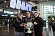 29 November 2018; Dublin players, from left, Con O'Callaghan, James McCarthy and Brian Howard with the Sam Maguire Cup at Dublin Airport prior to their departure to the PwC All Stars tour in Philadelphia, USA. Photo by David Fitzgerald/Sportsfile