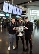 29 November 2018; Dublin players, from left, Con O'Callaghan, James McCarthy and Brian Howard with the Sam Maguire Cup at Dublin Airport prior to their departure to the PwC All Stars tour in Philadelphia, USA. Photo by David Fitzgerald/Sportsfile