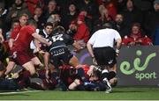 30 November 2018; Chris Farrell of Munster scores his side's first try despite the efforts of Dougie Fife of Edinburgh during the Guinness PRO14 Round 10 match between Munster and Edinburgh at Irish Independent Park in Cork. Photo by Diarmuid Greene/Sportsfile