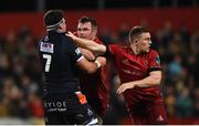 30 November 2018; Peter O'Mahony and Andrew Conway of Munster tussle off the ball with Lewis Wynne of Edinburgh during the Guinness PRO14 Round 10 match between Munster and Edinburgh at Irish Independent Park in Cork. Photo by Diarmuid Greene/Sportsfile