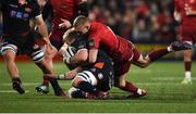30 November 2018; Luke Hamilton of Edinburgh is tackled by Keith Earls of Munster during the Guinness PRO14 Round 10 match between Munster and Edinburgh at Irish Independent Park in Cork. Photo by Diarmuid Greene/Sportsfile