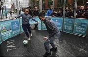 1 December 2018; Republic of Ireland international Niamh Farrelly, left, and Shane Boyle, from Sheriff Street in Dublin during a skills game as Portuguese footballing legends Luis Figo, Nuno Gomes and Vítor Baía were in Dublin to showcase their skills at the Street Legends Community Football Event on Commons Street. The Street Football Community Football event is a joint initiative by Dublin City Council and the Football Association of Ireland ahead of the UEFA EURO 2020 Qualifying Draw in the Convention Centre on Sunday, 2nd December. The Street Legends Community Football Events kicked off on Wednesday, November 28. Other key activations include: Street Legends Community Football, Saturday, December 1, 3pm to 6pm, Commons Street, Dublin 1 with Portuguese legends Nuno Gomes and Vítor Baía. National Football Exhibition, Sunday, December 2 to Sunday, December 9, 11am-7pm, The Printworks, Dublin Castle Both events are free to attend and open to all ages and abilities. Photo by Sam Barnes/Sportsfile