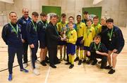 4 December 2018; St. Louis Community School, Kiltimagh, Mayo captain Sean O'Neill being presented with the cup by FAI President Donal Conway after the Post-Primary Schools National Futsal Finals at Waterford IT Sports Arena in Waterford. Photo by Eóin Noonan/Sportsfile