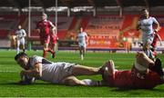 7 December 2018; Jacob Stockdale of Ulster scores his side's first try despite the tackle of James Davies of Scarlets during the European Rugby Champions Cup Pool 4 Round 3 match between Scarlets and Ulster at Parc Y Scarlets in Llanelli, Wales. Photo by Ramsey Cardy/Sportsfile