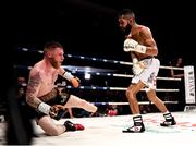 7 December 2018; Ray Moylette, left, is knocked to the canvas by Christian Uruzquieta during their vacant World Boxing Council International Silver Lightweight Title bout at The Royal Theatre in Castlebar, Mayo. Photo by Stephen McCarthy/Sportsfile