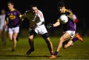 8 December 2018; Paul Curtis of Wexford in action against James Craven of Louth during the O'Byrne Cup Round 1 match between Louth and Wexford at the Darver Louth Centre of Excellence in Louth. Photo by David Fitzgerald/Sportsfile