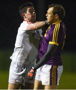 8 December 2018; Hugh Osbourne of Louth and Kevin O'Grady of Wexford tussle during the O'Byrne Cup Round 1 match between Louth and Wexford at the Darver Louth Centre of Excellence in Louth. Photo by David Fitzgerald/Sportsfile