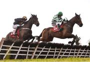 9 December 2018; Tornado Flyer, right, with Ruby Walsh up, jumps the last alongside eventual second place Take Revenge, left, with Donal McInerney up, on their way to winning the Punchestown Racecourse Of The Year Maiden Hurdle at Punchestown Racecourse in Naas, Co. Kildare. Photo by Seb Daly/Sportsfile