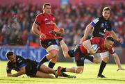 9 December 2018; Andrew Conway of Munster is tackled by Taylor Paris of Castres Olympique during the European Rugby Champions Cup Pool 2 Round 3 match between Munster and Castres at Thomond Park in Limerick. Photo by Brendan Moran/Sportsfile