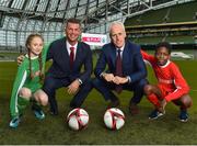 11 December 2018; SPAR, Ireland’s leading convenience retail group, and the Football Association of Ireland today announced a sponsorship agreement which will see SPAR renew as the Official Convenience Store of the FAI. The announcement took place at the Aviva Stadium with the Republic of Ireland’s new manager Mick McCarthy along with head coach of the Republic of Ireland Women's International Senior Team, Colin Bell in attendance. The partnership between SPAR and the FAI began in 2015 encompassing the Irish national football team and the hugely successful SPAR FAI Primary School 5s Programme. Pictured are, from left, Éabha Seery, age 12, from Clondalkin, Colin Bell, Republic of Ireland Women's National Team manager, Mick McCarthy, Republic of Ireland manager, and Murphy Alade, age 11, from Irishtown, during the 2018 SPAR and FAI Sponsorship Renewal at the Aviva Stadium in Dublin. Photo by Seb Daly/Sportsfile