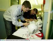 10 September 2003; Enda McGinley, left, and Michael McGee autograph footballs and shirts during the Tyrone GAA press night ahead of the 2003 Bank of Ireland All-Ireland Football Championship Final against Armagh. Carrickmore, Co. Tyrone. Picture credit; SPORTSFILE *EDI*