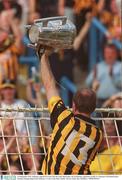 14 September 2003; Kilkenny captain D.J Carey lifts the Liam MacCarthy cup to Kilkenny supporters in Hill 16. Guinness All-Ireland Senior Hurling Championship Final, Kilkenny v Cork, Croke Park, Dublin. Picture credit; Ray McManus / SPORTSFILE