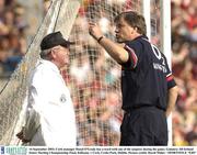 14 September 2003; Cork manager Donal O'Grady has a word with one of the umpires during the game. Guinness All-Ireland Senior Hurling Championship Final, Kilkenny v Cork, Croke Park, Dublin. Picture credit; David Maher / SPORTSFILE *EDI*