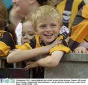 14 September 2003; A young Kilkenny fan watches his side during the game. Guinness All-Ireland Senior Hurling Championship Final, Kilkenny v Cork, Croke Park, Dublin. Picture credit; David Maher / SPORTSFILE *EDI*