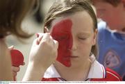 14 September 2003; A young Cork fan has her face painted before the game. Guinness All-Ireland Senior Hurling Championship Final, Kilkenny v Cork, Croke Park, Dublin. Picture credit;  Brendan Moran / SPORTSFILE *EDI*