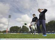 19 September 2003; Leinster and Ireland centre Brian O'Driscoll launched the inaugural Powerade Rugby Skills Challenge at Donnybrook. The initiative will run in Leinster schools and is aimed at rugby players in 1st and 2nd year. Brian shows some kicking skills to Diarmuid Meldon, from Blackrock College, at the launch. Picture credit; Brendan Moran / SPORTSFILE *EDI*