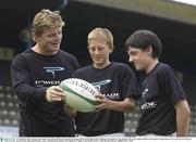 19 September 2003; Leinster and Ireland centre Brian O'Driscoll launched the inaugural Powerade Rugby Skills Challenge at Donnybrook. The initiative will run in Leinster schools and is aimed at rugby players in 1st and 2nd year. Brian is pictured with Tighernach Murphy, centre, and Diarmuid Meldon, from Blackrock College, at the launch. Picture credit; Brendan Moran / SPORTSFILE *EDI*