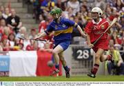 21 September 2003; Emer McDonnell, Tipperary, beats Cork's Joanne O'Callaghan on her way to scoring her sides first goal. Foras na Gaeilge All-Ireland Senior Championship Final, Cork v Tipperary, Croke Park, Dublin. Picture credit; Pat Murphy / SPORTSFILE *EDI*