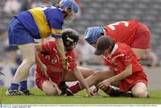 21 September 2003; Deirdre Hughes, Tipperary, in action against Cork players (l to r ) Stephanie Dunlea, Denise Cronin, 3, and 'keeper Ger Casey. Foras na Gaeilge All-Ireland Senior Championship Final, Cork v Tipperary, Croke Park, Dublin. Picture credit; Ray McManus / SPORTSFILE *EDI*
