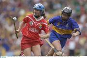 21 September 2003; Jennifer O'Leary, Cork, in action against Tipperary's Claire Madden. Foras na Gaeilge All-Ireland Senior Championship Final, Cork v Tipperary, Croke Park, Dublin. Picture credit; Ray McManus / SPORTSFILE *EDI*