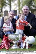 23 September 2003; Armagh manager Joe Kernan, right, and Tyrone manager Mickey Harte with Armagh supporter Oisin O'Hagan and Tyrone supporter Martha Rose McCamley, both aged 2, during a photocall before Sunday's Bank of Ireland All-Ireland Senior Football Championship Final. City Hall, Belfast. Picture credit; David Maher / SPORTSFILE *EDI*