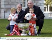 23 September 2003; Armagh manager Joe Kernan, right and Tyrone manager Mickey Harte with Armagh supporter Oisin O'Hagan and Tyrone supporter Martha Rose McCamley, both aged 2, during a photocall before Sunday's Bank of Ireland All-Ireland Senior Football Championship Final. City Hall, Belfast. Picture credit; David Maher / SPORTSFILE *EDI*