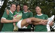 24 September 2003; The Irish rugby team took time out of their Rugby World Cup training schedule to launch the Repak National Recycling week with a rugby ball made from recycled materials. Pictured at the launch are players Denis Hickie, Malcolm O'Kelly and Peter Stringer with model Roberta Rawat. Picture credit; Brendan Moran / SPORTSFILE *EDI*