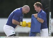 25 September 2003; Ireland's John Hayes goes through some fitness exercises with fitness director Michael McGurn during squad training. Irish Pre World Cup Rugby training, Terenure College RFC, Lakelands Park, Dublin. Picture credit; Brendan Moran / SPORTSFILE *EDI*