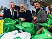 12 December 2018; FAI CEO John Delaney, left, along with Republic of Ireland Women’s National Team manager Colin Bell, right, were on hand today to hand over Ireland bags filled with jerseys, footballs, scarfs & other merchandise to Liam Casey, centre, East Region President, St Vincent De Paul, at the St Vincent De Paul depot on Sean McDermott Street, Dublin. The gifts are part of an annual Christmas donation for families in need. Photo by Seb Daly/Sportsfile