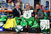 12 December 2018; FAI CEO John Delaney, left, along with Republic of Ireland Women’s National Team manager Colin Bell, right, were on hand today to hand over Ireland bags filled with jerseys, footballs, scarfs & other merchandise to Liam Casey, centre, East Region President, St Vincent De Paul, at the St Vincent De Paul depot on Sean McDermott Street, Dublin. The gifts are part of an annual Christmas donation for families in need. Photo by Seb Daly/Sportsfile