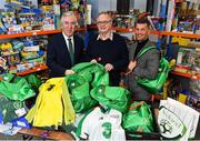 12 December 2018; FAI CEO John Delaney, left, along with Republic of Ireland Women’s National Team manager Colin Bell, right, were on hand today to hand over Ireland bags filled with jerseys, footballs, scarfs & other merchandise to Liam Casey, centre, East Region President, St Vincent De Paul, at the St Vincent De Paul depot on Sean McDermott Street, Dublin. The gifts are part of an annual Christmas donation for families in need. Photo by Seb Daly/Sportsfile