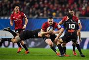15 December 2018; Rory Scannell of Munster is tackled by Florian Vialelle of Castres Olympique during the Heineken Champions Cup Pool 2 Round 4 match between Castres and Munster at Stade Pierre Fabre in Castres, France. Photo by Brendan Moran/Sportsfile