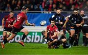 15 December 2018; Conor Murray of Munster offloads the ball to team-mate Rory Scannell while being tackled by Florian Vialelle of Castres Olympique during the Heineken Champions Cup Pool 2 Round 4 match between Castres and Munster at Stade Pierre Fabre in Castres, France. Photo by Brendan Moran/Sportsfile
