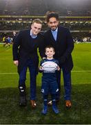 15 December 2018; Matchday mascot 5 year old Conor Ó Buachalla, from Kilmacud, Dublin, with Leinster players Nick McCarthy and Joe Tomane ahead of the European Rugby Champions Cup Pool 1 Round 4 match between Leinster and Bath at the Aviva Stadium in Dublin. Photo by Ramsey Cardy/Sportsfile