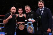 15 December 2018; Katie Taylor with trainer Ross Enamait, left, manager Brian Peters, and promoter Eddie Hearn, right, after defeating Eva Wahlstrom in their WBA & IBF World Lightweight Championship fight at Madison Square Garden in New York, USA. Photo by Ed Mulholland / Matchroom Boxing USA via Sportsfile