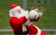 16 December 2018; Santa Claus of The North Pole saves a penalty from former jockey Johnny Murtagh during a half-time competition during the Seán Cox Fundraising match between Meath and Dublin at Páirc Tailteann in Navan, Co Meath. Photo by Piaras Ó Mídheach/Sportsfile