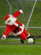 16 December 2018; Santa Claus of The North Pole saves a penalty from former Meath footballer Graham Geraghty during a half-time competition during the Seán Cox Fundraising match between Meath and Dublin at Páirc Tailteann in Navan, Co Meath. Photo by Piaras Ó Mídheach/Sportsfile