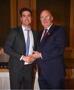 22 December 2018; Michael Darragh Macauley of Dublin is presented with his GAA Football All-Ireland Senior Championship medal by Uachtarán Chumann Lúthchleas Gael John Horan at the InterContinental Dublin, Simmonscourt Road, Ballsbridge, Dublin Photo by Ray McManus/Sportsfile