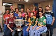 25 December 2018; Eoin Murchan, Stephen Cluxton and Jack McCaffrey, with staff on duty in the A and E department, Imenda Farren, Loughrea, Co Galway, Anne Marie McGuire, Kilmurry Ibrickane, Clare, Kiera Byrne, Ardcath, Meath, Ruth Dunne, Birr, Offaly, Hannagh O'Farrel, Cork, Anne Lynch, Longford, Maeve O'Sullivan, Clonmel, Tipperary, Alice Griffin, Ballybophey, Donegal, Lyndsey Singleton, Donamede, Dublin, and Orla O'Farrell,, Edgeworthstown, Longford, and the Sam Maguire Cup during the Dublin Football team visit to Beaumont Hospital in Dublin.  Photo by Ray McManus/Sportsfile