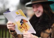28 December 2018; Victoria Cottrell, from Newmarket, Co Cork, inspects the programme prior to day three of the Leopardstown Festival at Leopardstown Racecourse in Dublin. Photo by David Fitzgerald/Sportsfile