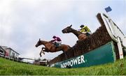 28 December 2018; Gun Digger, with Jack Kennedy up, left, clear the last ahead of Borderline Chatho, who did not finish, with Donagh Meyler up, on their way to winning the Ballymaloe Foods Beginners Steeplechase during day three of the Leopardstown Festival at Leopardstown Racecourse in Dublin. Photo by David Fitzgerald/Sportsfile