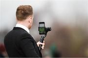 28 December 2018; A racegoer videos the Ballymaloe Foods Beginners Steeplechase during day three of the Leopardstown Festival at Leopardstown racecourse in Dublin. Photo by Barry Cregg/Sportsfile