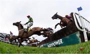 28 December 2018; Coney Island, with Mark Walsh up, left, jumps the last alongside other runners and riders during the Savills Steeplechase during day three of the Leopardstown Festival at Leopardstown Racecourse in Dublin. Photo by David Fitzgerald/Sportsfile