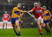 29 December 2018; Gary Cooney of Clare in action against Tim O'Mahony of Cork during the Co-Op Superstores Munster Hurling League 2019 match between Clare and Cork at Cusack Park in Clare. Photo by Harry Murphy/Sportsfile