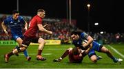29 December 2018; James Lowe of Leinster is tackled by Mike Haley of Munster during the Guinness PRO14 Round 12 match between Munster and Leinster at Thomond Park in Limerick. Photo by Ramsey Cardy/Sportsfile