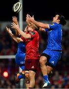 29 December 2018; Andrew Conway of Munster in action against Noel Reid, left, and James Lowe of Leinster during the Guinness PRO14 Round 12 match between Munster and Leinster at Thomond Park in Limerick. Photo by Ramsey Cardy/Sportsfile