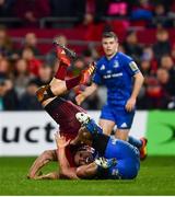 29 December 2018; Andrew Conway of Munster is tackled by James Lowe of Leinster, for which James Lowe was shown a red card, during the Guinness PRO14 Round 12 match between Munster and Leinster at Thomond Park in Limerick. Photo by Ramsey Cardy/Sportsfile