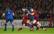 29 December 2018; Jonathan Sexton of Leinster is tackled by Joey Carbery and Rory Scannell of Munster during the Guinness PRO14 Round 12 match between Munster and Leinster at Thomond Park in Limerick. Photo by Diarmuid Greene/Sportsfile